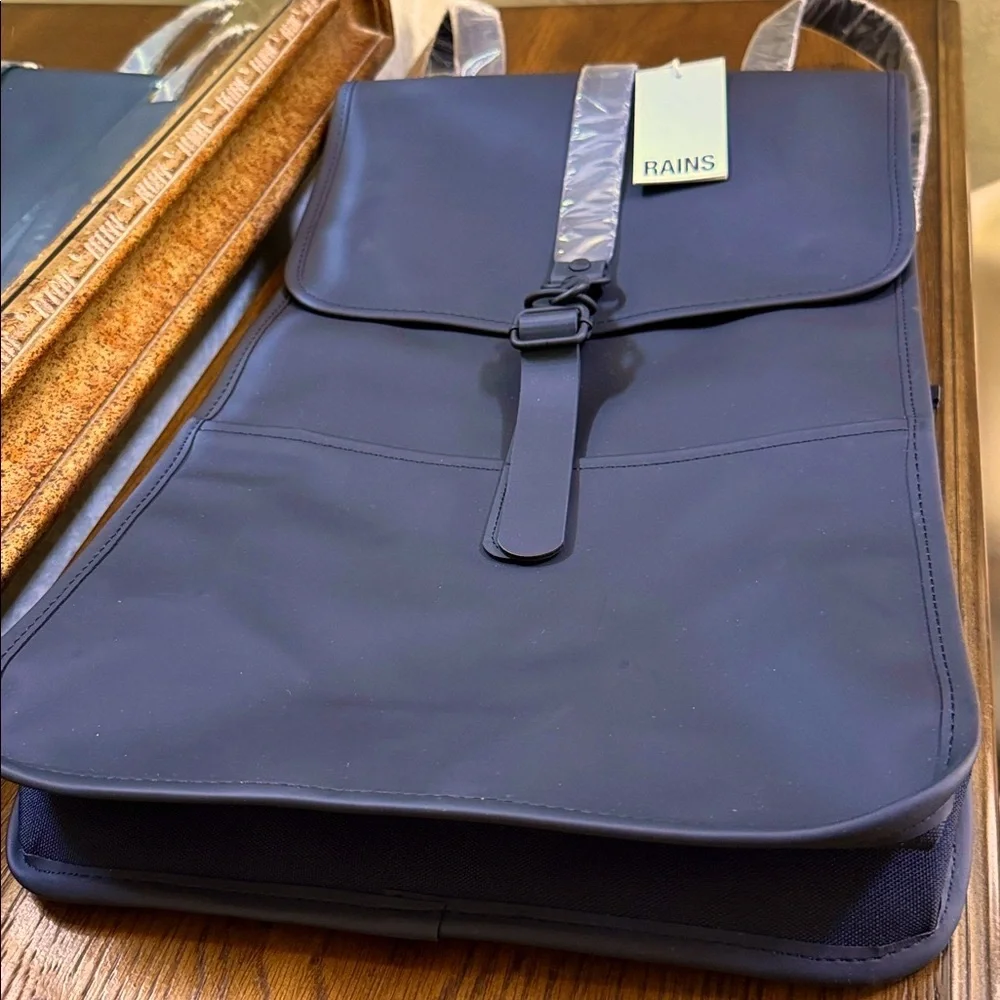 Rains Black Backpack. Clean and ever contemporary.
